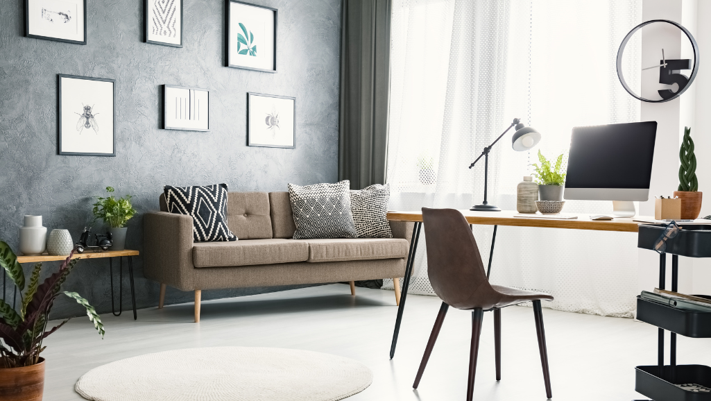 A serene home office with a wooden desk, a neatly stacked pile of papers, and a small potted plant. Rays of warm afternoon sunlight stream through a large window, casting a soft glow on the workspace. Atop the desk, a small trophy or award symbolizes a recent achievement, a visual representation of the "small wins" that fuel progress and motivation. The overall atmosphere is one of quiet, focused productivity, reflecting the power of incremental successes to build momentum and drive towards larger goals.